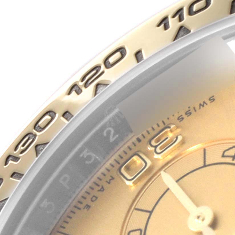 This close-up image shows a partial view of the bezel and dial of a Rolex Daytona 116503 Men
s Steel and Gold (two tone) Champagne Dial 116503 Men
s Steel and Gold (two tone) Champagne Dial watch.