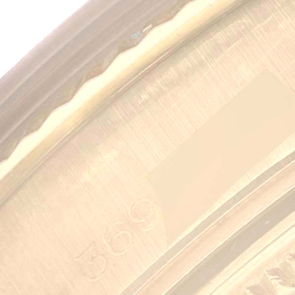 This close-up image showcases part of a serial number engraved inside the case of a Vintage Collection Rolex watch.