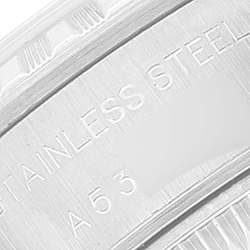 This image shows a close-up of the serial number and "STAINLESS STEEL" inscription on the back of a Rolex Date 79240 Women
s Stainless Steel Blue Dial 79240 Women
s Stainless Steel Blue Dial model watch.