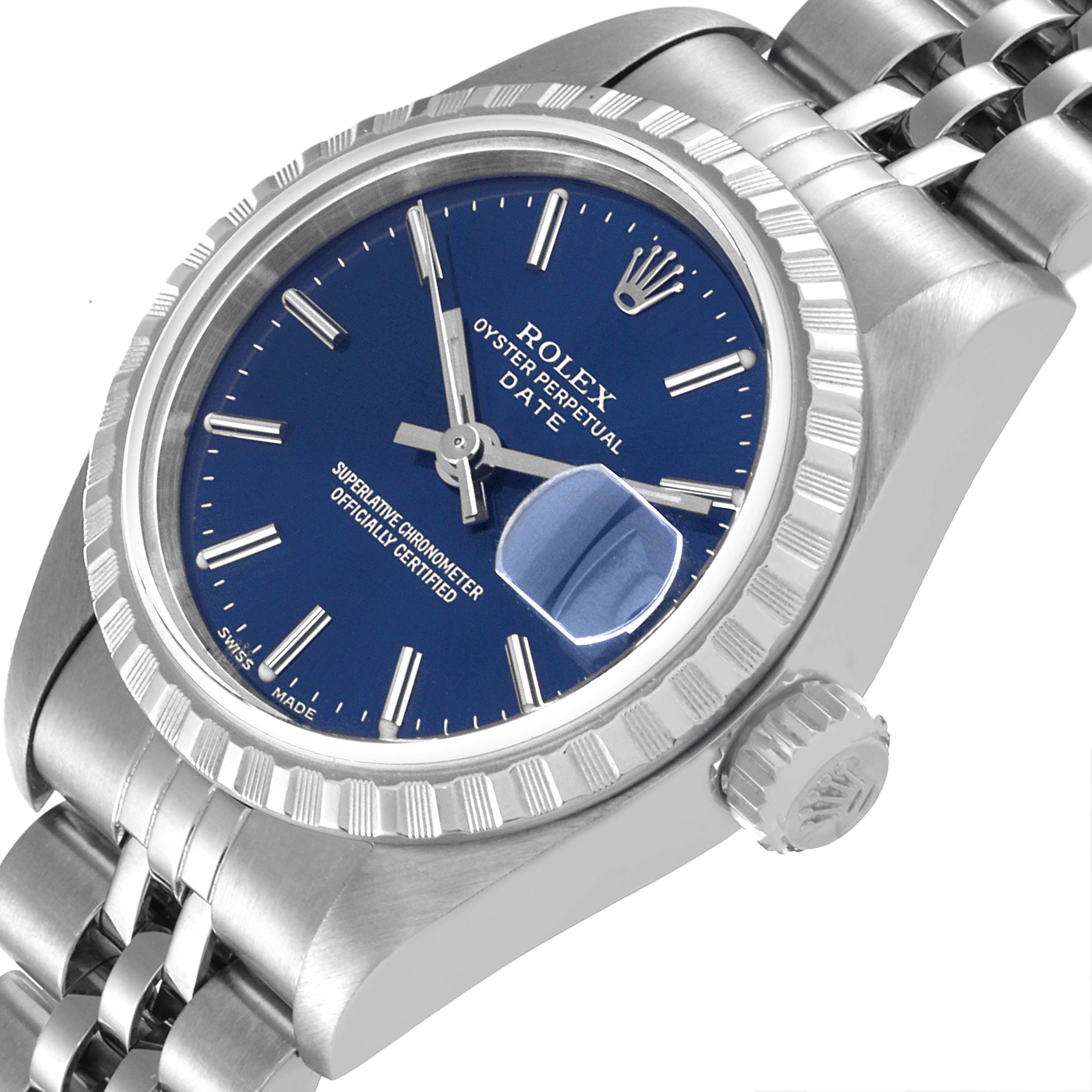 The image shows a Rolex Oyster Perpetual Date model watch, viewed at a slight angle highlighting the dial, bezel, and part of the bracelet.