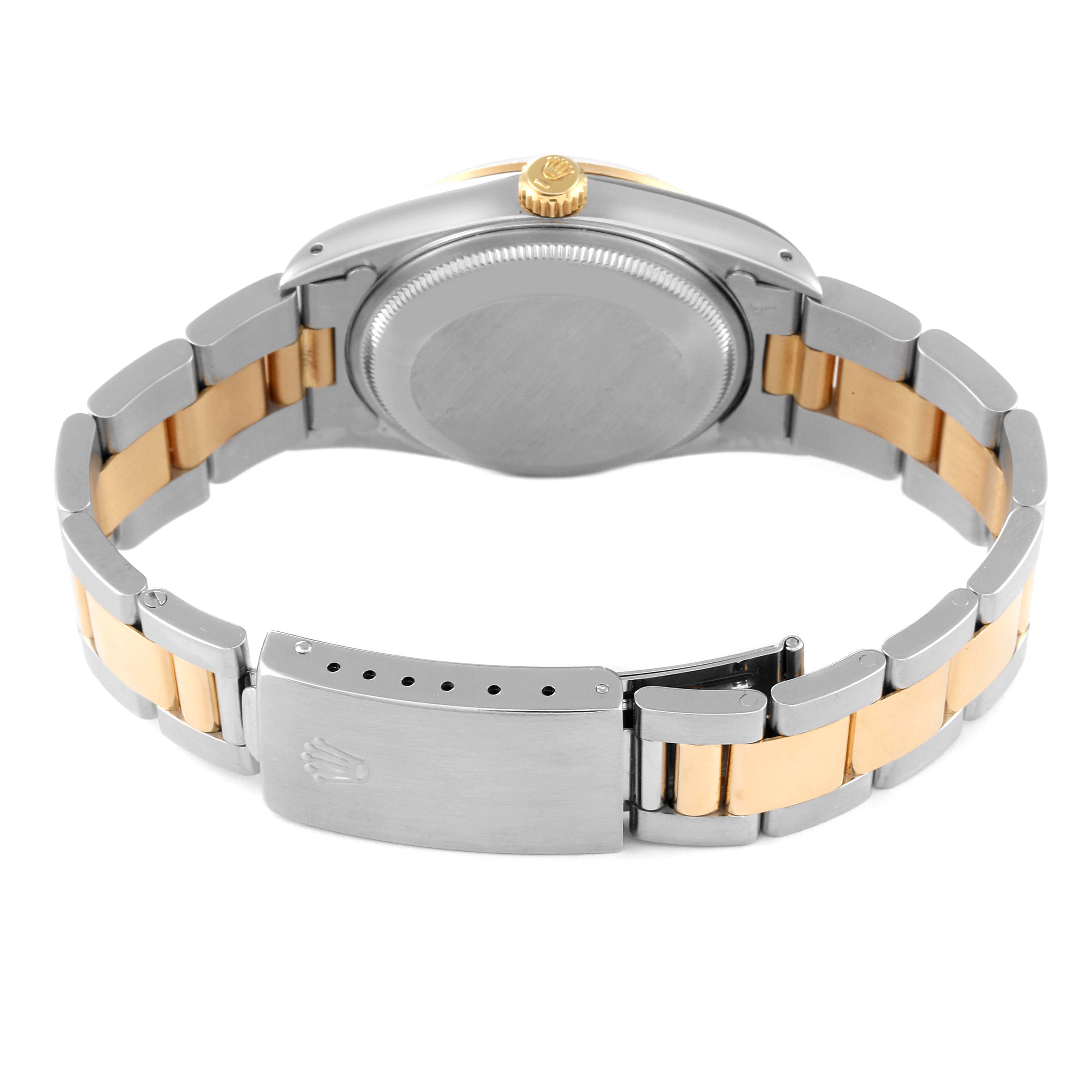 This image shows the case back and the partly open clasp of a Rolex Date 15223 Men's Steel and Gold (two tone) White Dial 15223 Men's Steel and Gold (two tone) White Dial model, highlighting its two-tone bracelet.