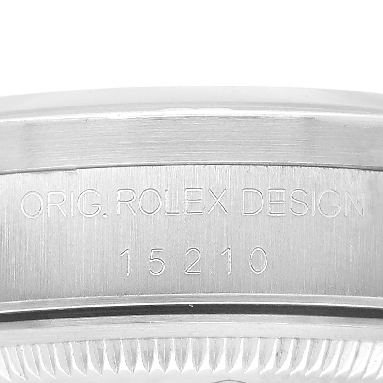 The image shows a close-up of the side of a Rolex Date 15210 Men's Stainless Steel White Dial model, highlighting the engraved design and model number.