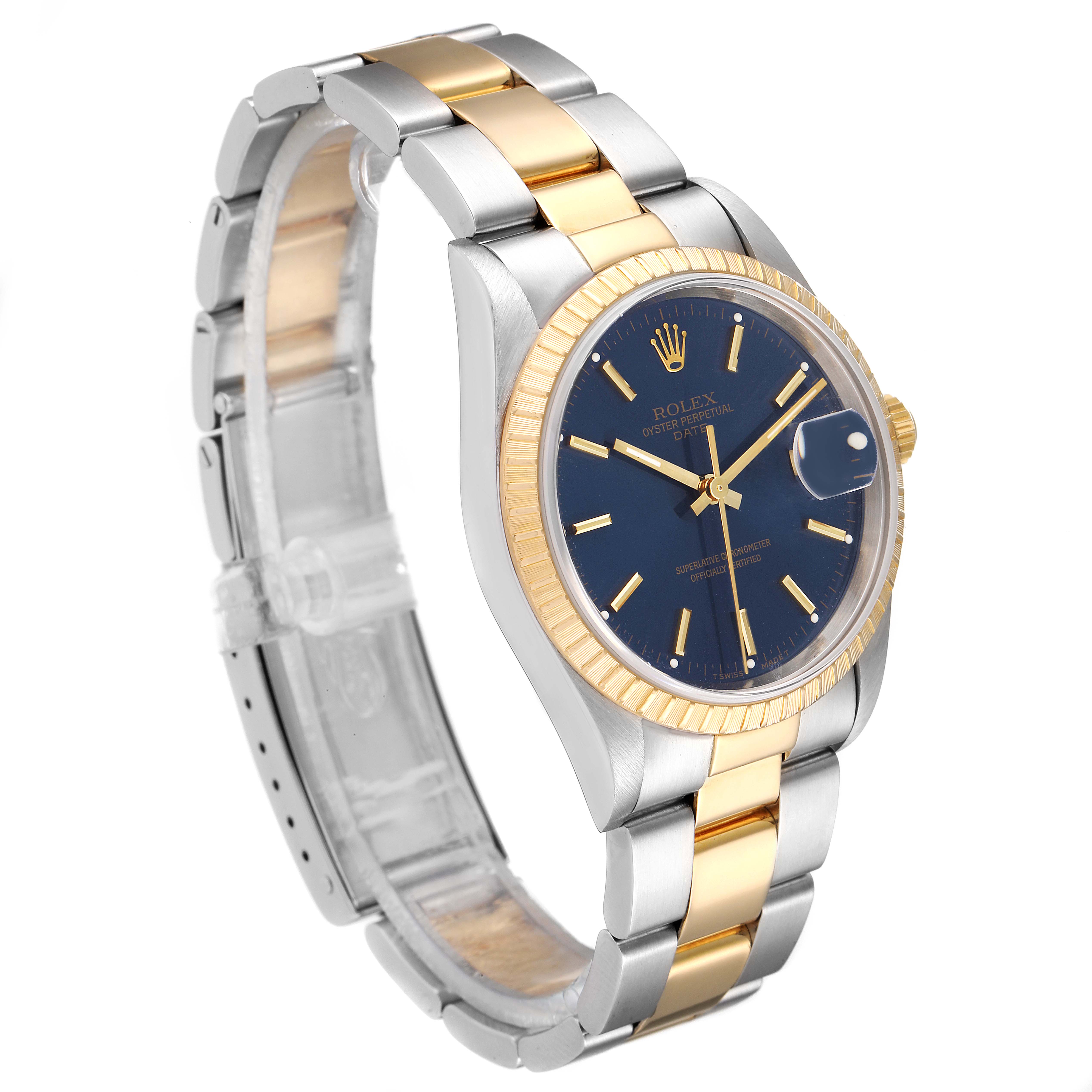 The Rolex Datejust 15223 Men's Steel and Gold (two tone) Blue Dial 15223 Men's Steel and Gold (two tone) Blue Dial watch is shown from an angled view, displaying its face, two-tone bracelet, and fluted bezel.