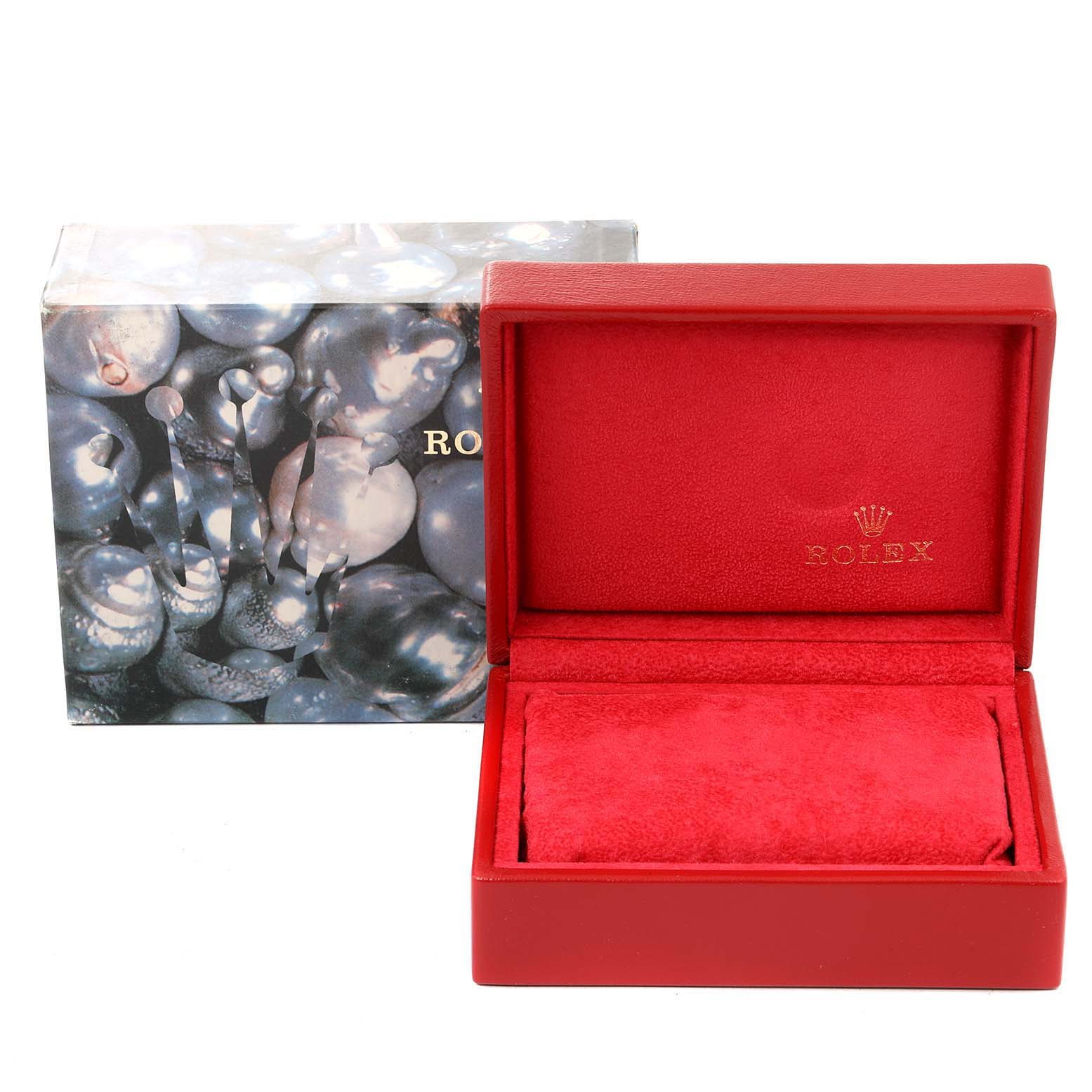 This image shows an empty red Rolex Datejust 69173 Women's Steel and Gold (two tone) Champagne Dial 69173 Women's Steel and Gold (two tone) Champagne Dial watch box and an outer decorative sleeve, viewed from the front.