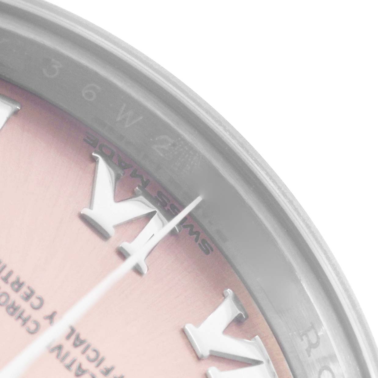 The image shows a close-up of the Rolex Datejust 279160 Women's Stainless Steel Pink Dial dial, highlighting Roman numerals and the "Swiss Made" text at an angle.