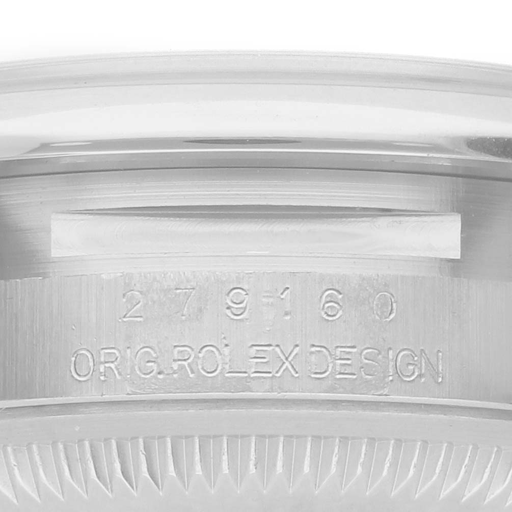 The image shows a close-up of the side of a Rolex Datejust 279160 Women's Stainless Steel Pink Dial, highlighting the engraved model number and design details.