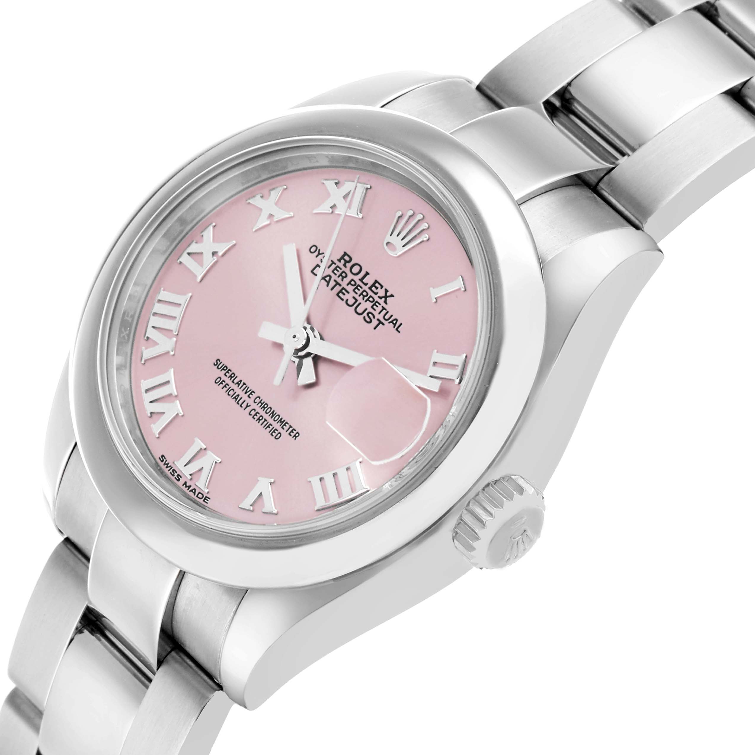 The Rolex Datejust 279160 Women's Stainless Steel Pink Dial watch is shown at a slight angle displaying the pink dial, crown, and a portion of the bracelet.