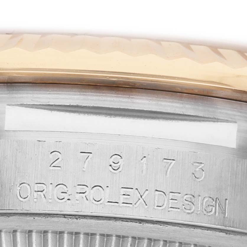 The image shows the side view of a Rolex Datejust 279173 Women's Steel and Gold (two tone) Mother of Pearl Dial case, highlighting the engraved serial and design numbers.