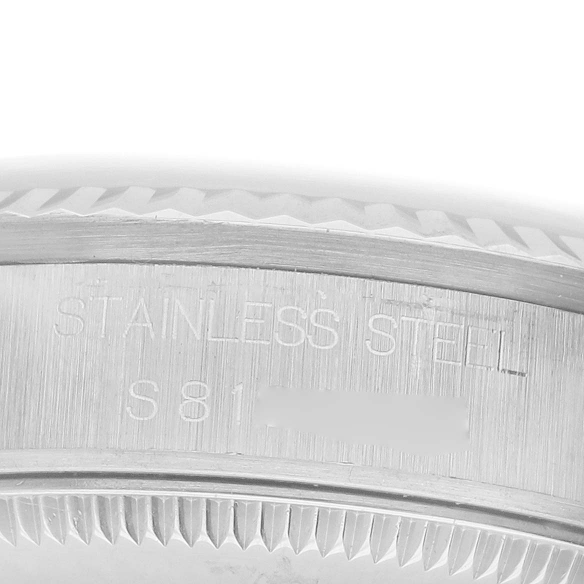 The image shows a close-up of the Rolex Datejust 68274 Women's Stainless Steel Silver Dial's stainless steel case with visible engraving.