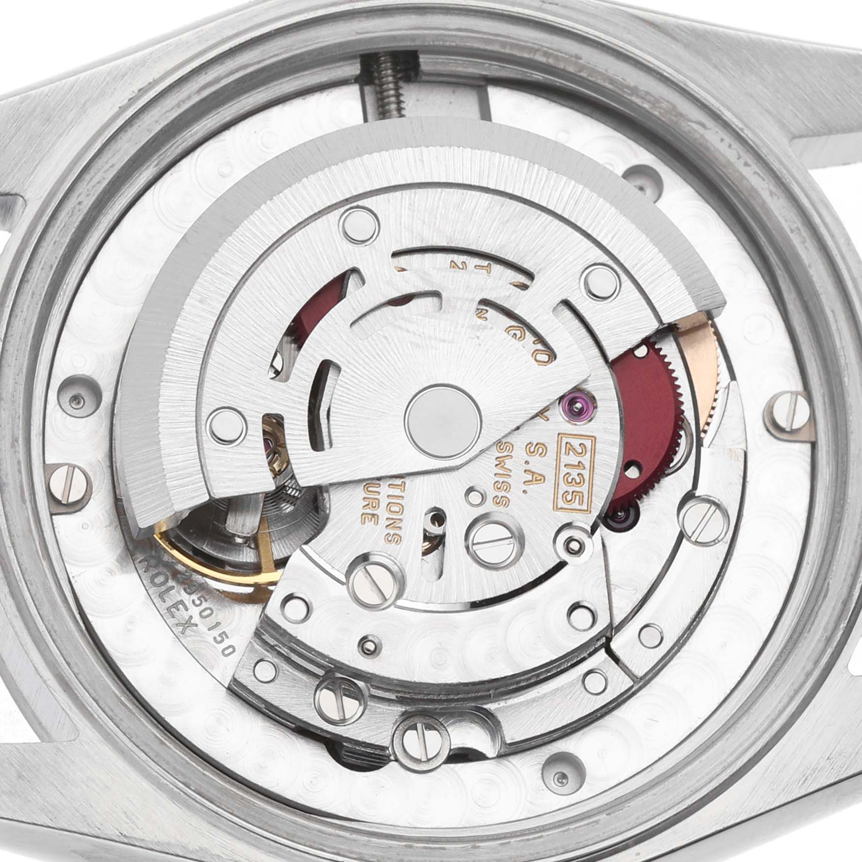 The image shows a close-up view of the movement inside a Rolex Datejust 68274 Women's Stainless Steel Silver Dial, highlighting gears and components.