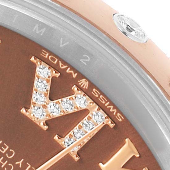 The image shows a close-up of the Rolex Datejust 278341 Women's Steel and Gold (two tone) Brown Dial's dial edge with diamond-set Roman numeral details and part of the case.
