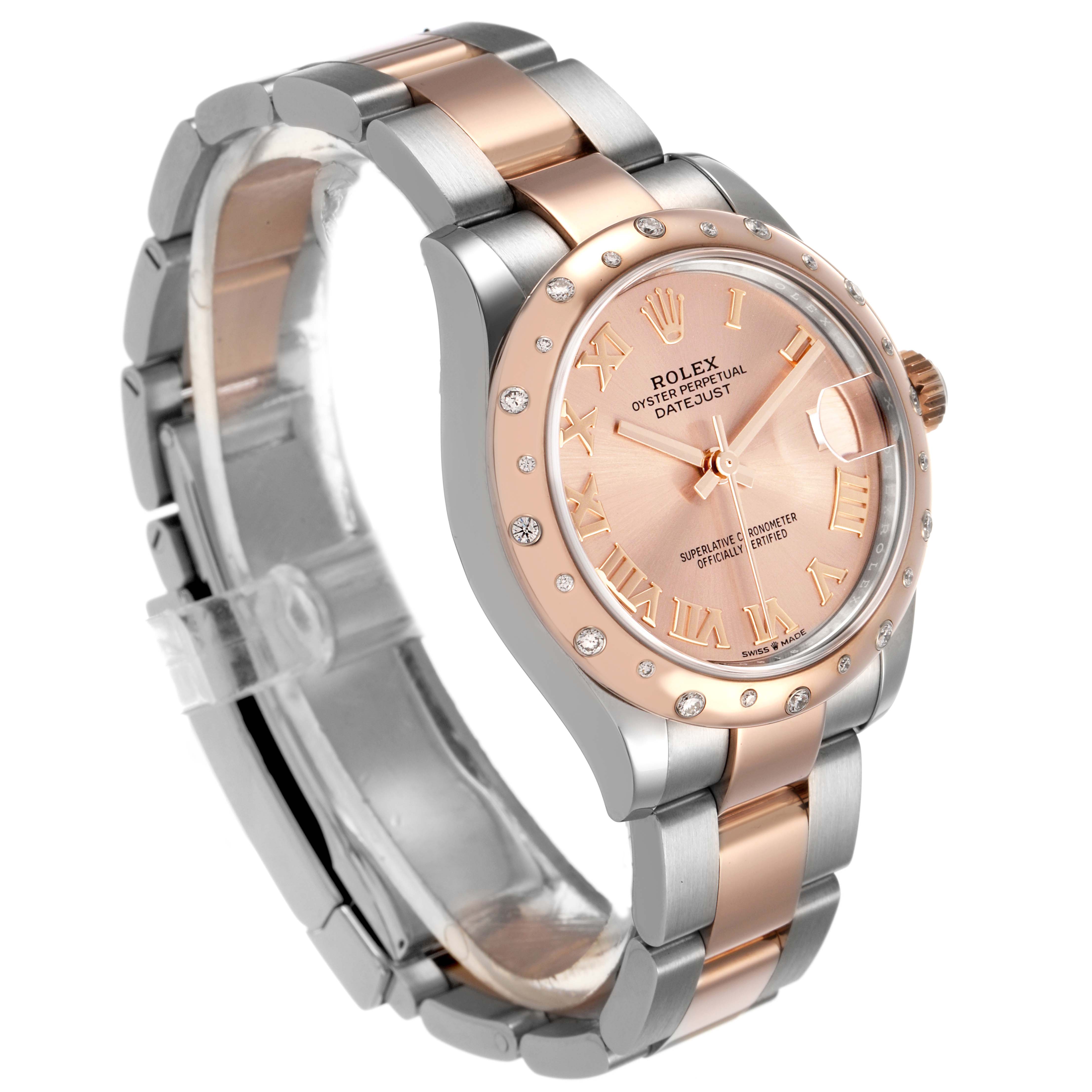 The Rolex Datejust Women's Steel and Gold (two tone) Pink Dial watch is shown at a three-quarter angle, displaying its dial, bezel, crown, and part of the bracelet.