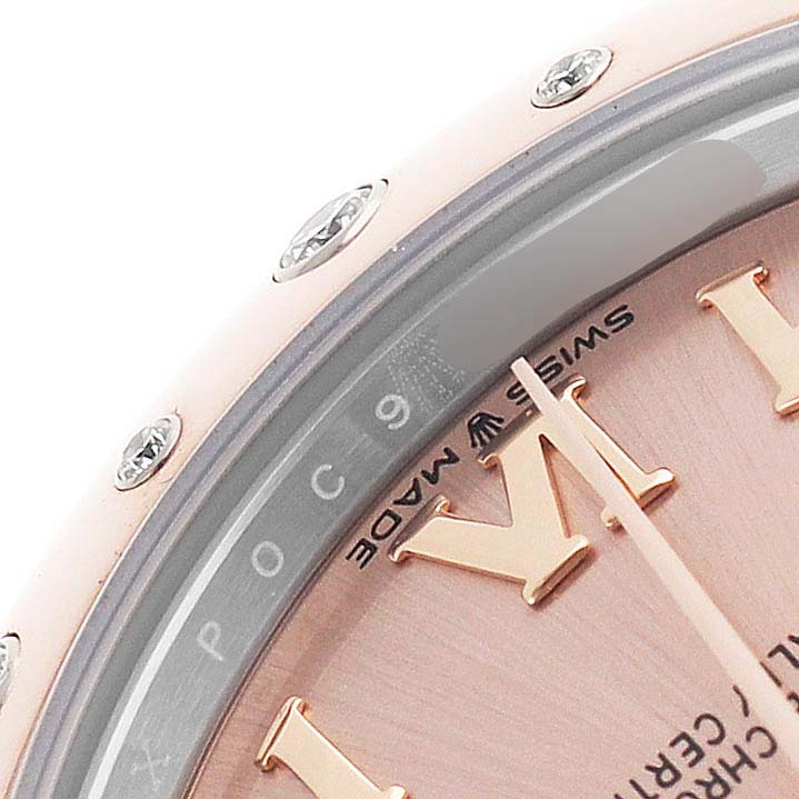 The image shows a close-up of the dial and bezel of a Rolex Datejust Women's Steel and Gold (two tone) Pink Dial, highlighting the Roman numeral hour markers and "Swiss Made" text.