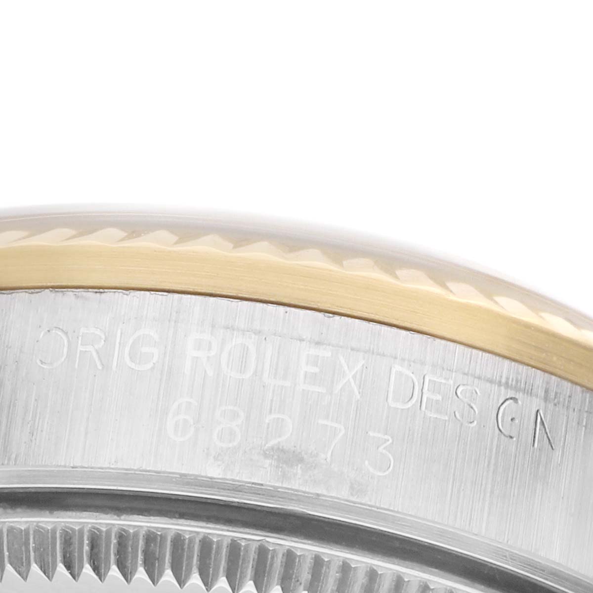 The image shows a close-up side view of a Rolex Datejust 68273 Women's Steel and Gold (two tone) Champagne Dial, highlighting the engraved stainless steel case with a gold bezel.