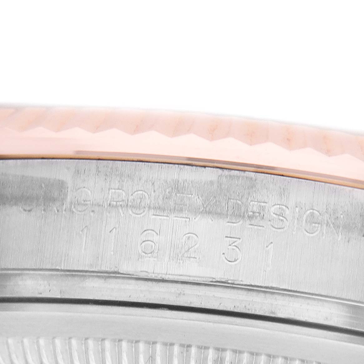 The image shows a close-up of a Rolex Datejust 116231 Men's Steel and Gold (two tone) Silver Dial's case side, highlighting the engraved model number and fluted bezel.