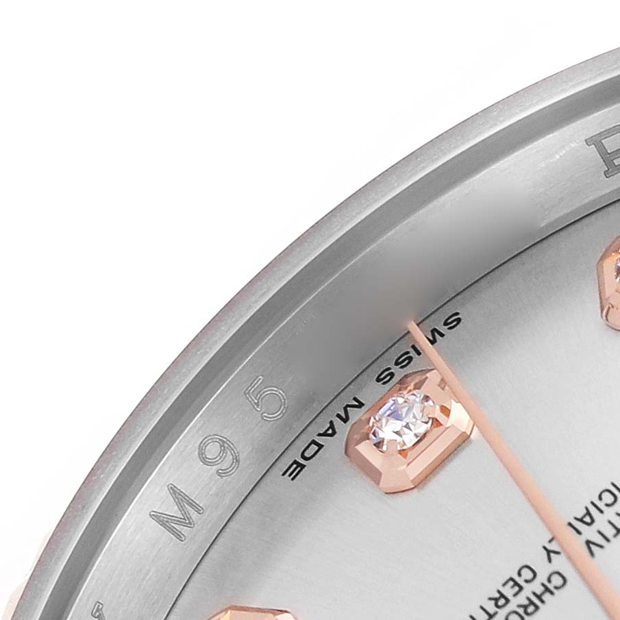The image shows a close-up of the dial edge, hour marker, and text on a Rolex Datejust 116231 Men's Steel and Gold (two tone) Silver Dial watch.
