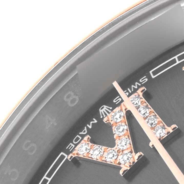 The image shows a close-up of the dial and hand of a Rolex Datejust 126201 Men's Steel and Gold (two tone) Grey Dial 126201 Men's Steel and Gold (two tone) Grey Dial, highlighting the crystal-encrusted Roman numeral and "Swiss Made" text.
