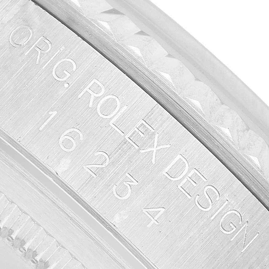 The image shows a close-up of the case engraving on a Rolex Datejust 16234 Men's Stainless Steel Silver Dial, highlighting the "Rolex Design" and model number.