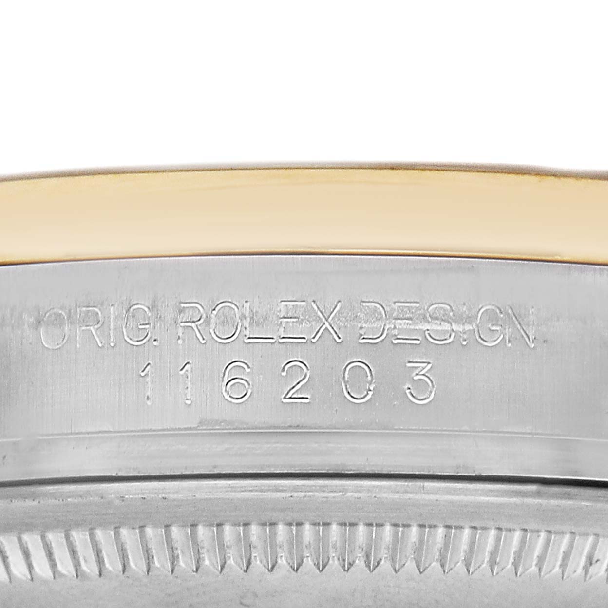The image shows a close-up of the side engraving on a Rolex Datejust 116203 Men's Steel and Gold (two tone) Champagne Dial watch case.