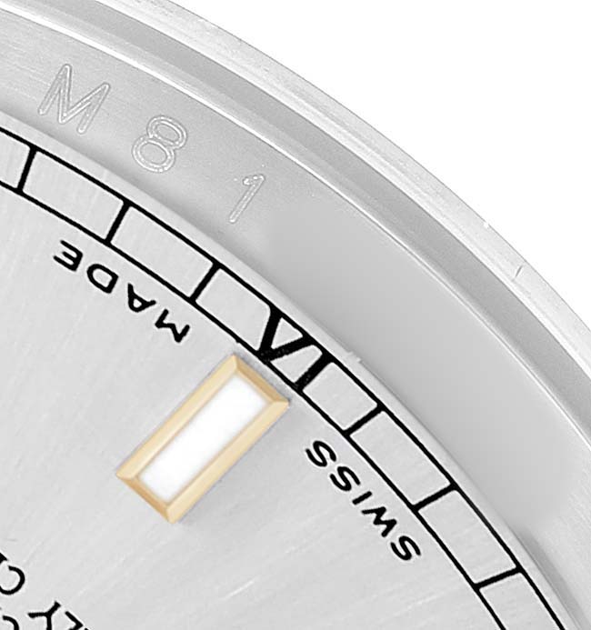 The image shows a close-up of the dial edge of a Rolex Datejust 116203 Men's Steel and Gold (two tone) Silver Dial, highlighting the hour marker, the "Swiss Made" text, and part of the chapter ring.