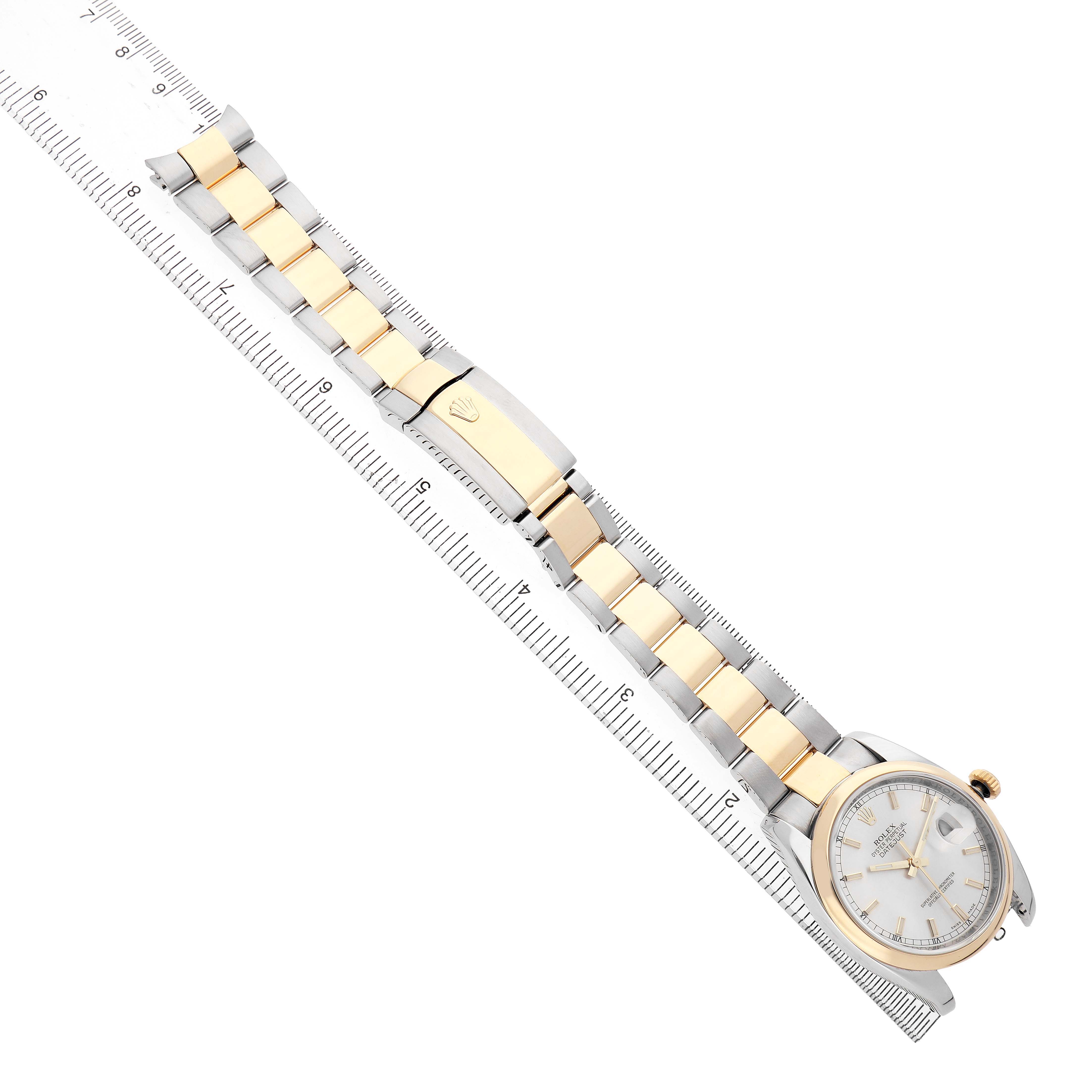 The Rolex Datejust 116203 Men's Steel and Gold (two tone) Silver Dial watch is shown from a top-down angle, displaying the dial, bezel, and two-tone bracelet with a clasp.