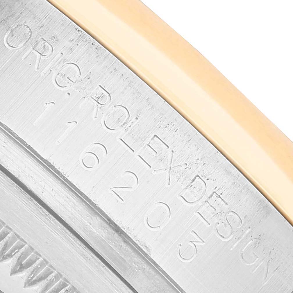 The image shows a close-up of the Rolex Datejust 116203 Men's Steel and Gold (two tone) Silver Dial watch, focusing on the engraved serial and model numbers on the case side.