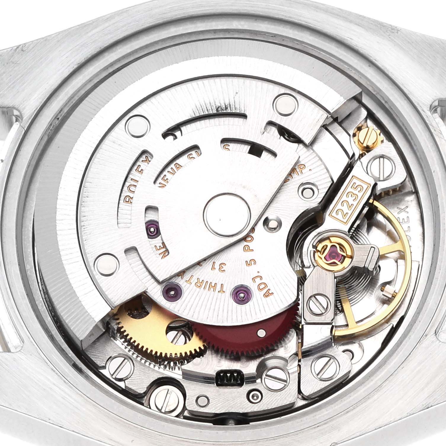 The image shows the movement of a Rolex Datejust 179173 Women's Steel and Gold (two tone) Silver Dial watch from the back, highlighting gears and mechanical components.