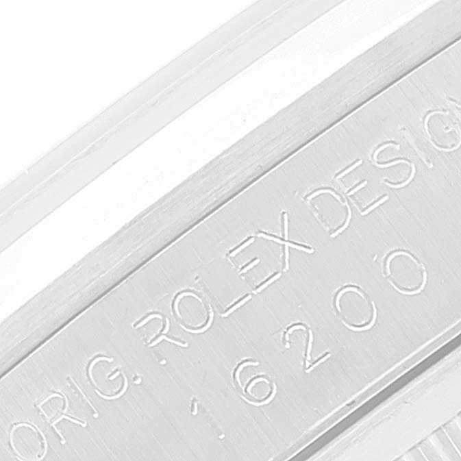 The image shows a close-up of the engraved serial number and "ROLEX DESIGN" on the case of a Rolex Datejust 16200 Men's Stainless Steel Silver Dial 16200 Men's Stainless Steel Silver Dial watch.