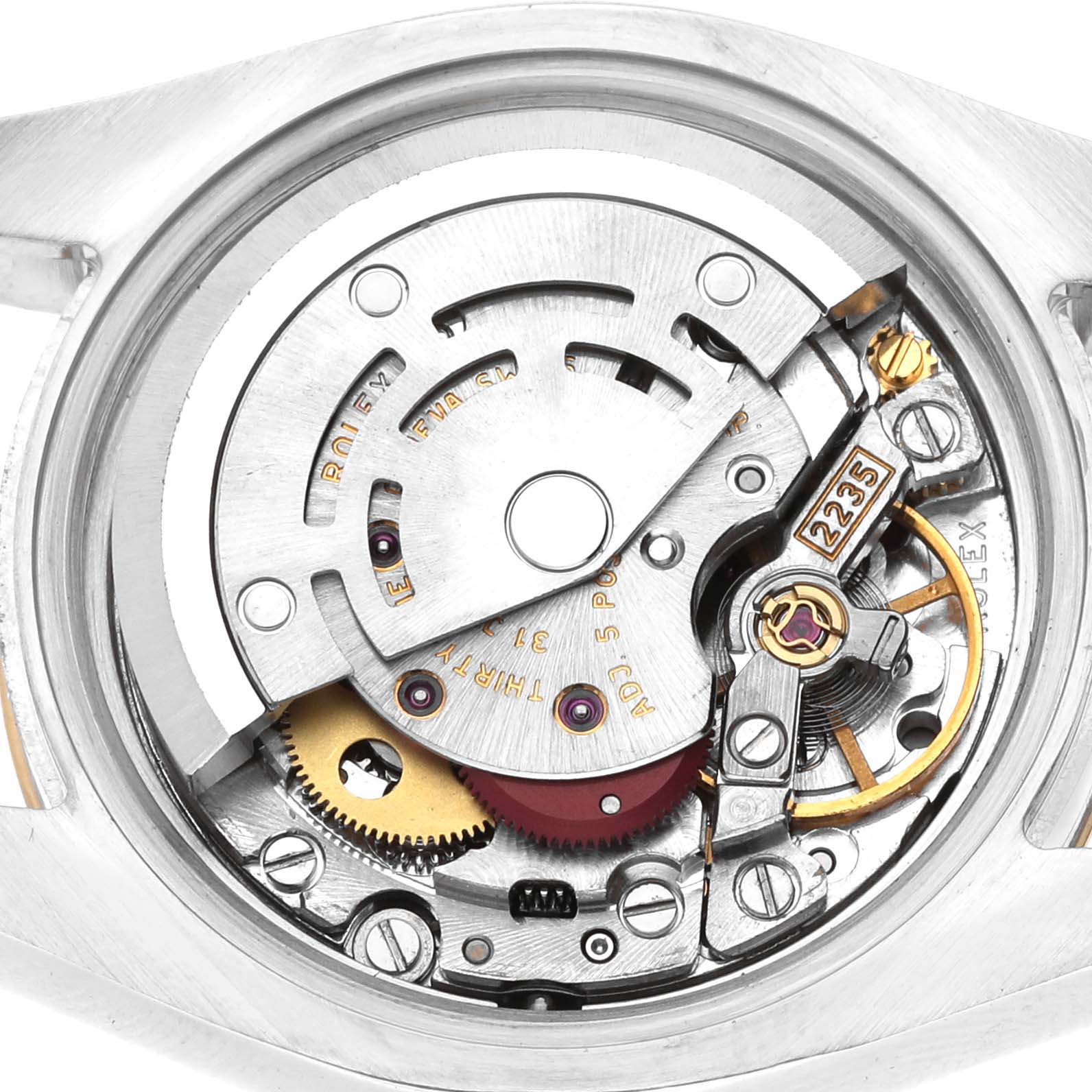 The image shows the movement of a Rolex Datejust 179173 Women's Steel and Gold (two tone) White Dial watch, focusing on the intricate internal mechanics.