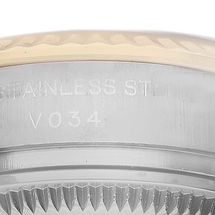 The image shows a close-up side view of the bezel and case edge of the Rolex Datejust 179173 Women's Steel and Gold (two tone) White Dial, highlighting the metal and markings.