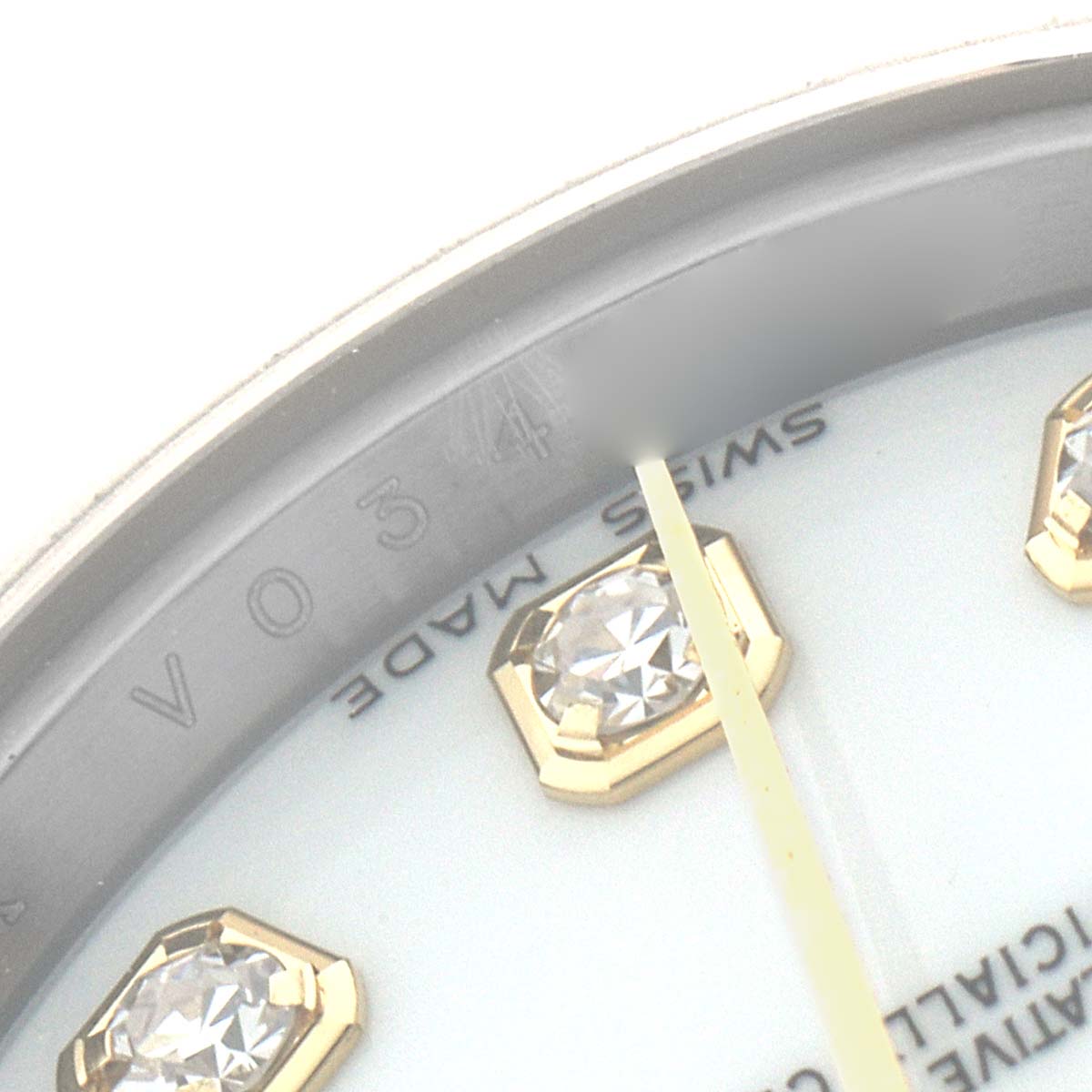 The image shows a close-up of the Rolex Datejust 179173 Women's Steel and Gold (two tone) White Dial dial, highlighting diamond hour markers and part of the dial text.