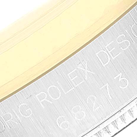 The image shows a close-up of the bezel and case side of a Rolex Datejust 68273 Women's Steel and Gold (two tone) Black Dial 68273 Women's Steel and Gold (two tone) Black Dial watch, highlighting the engraved model details.