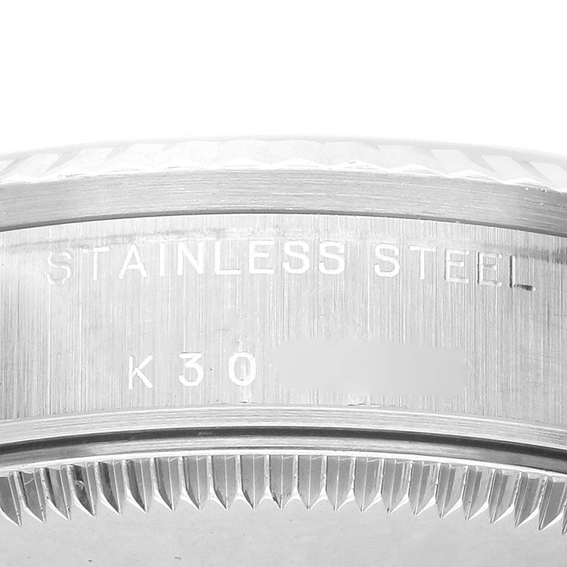 The image shows a close-up of the edge of a Rolex Datejust 78274 Women's Stainless Steel Silver Dial watch case, highlighting the stainless steel material.