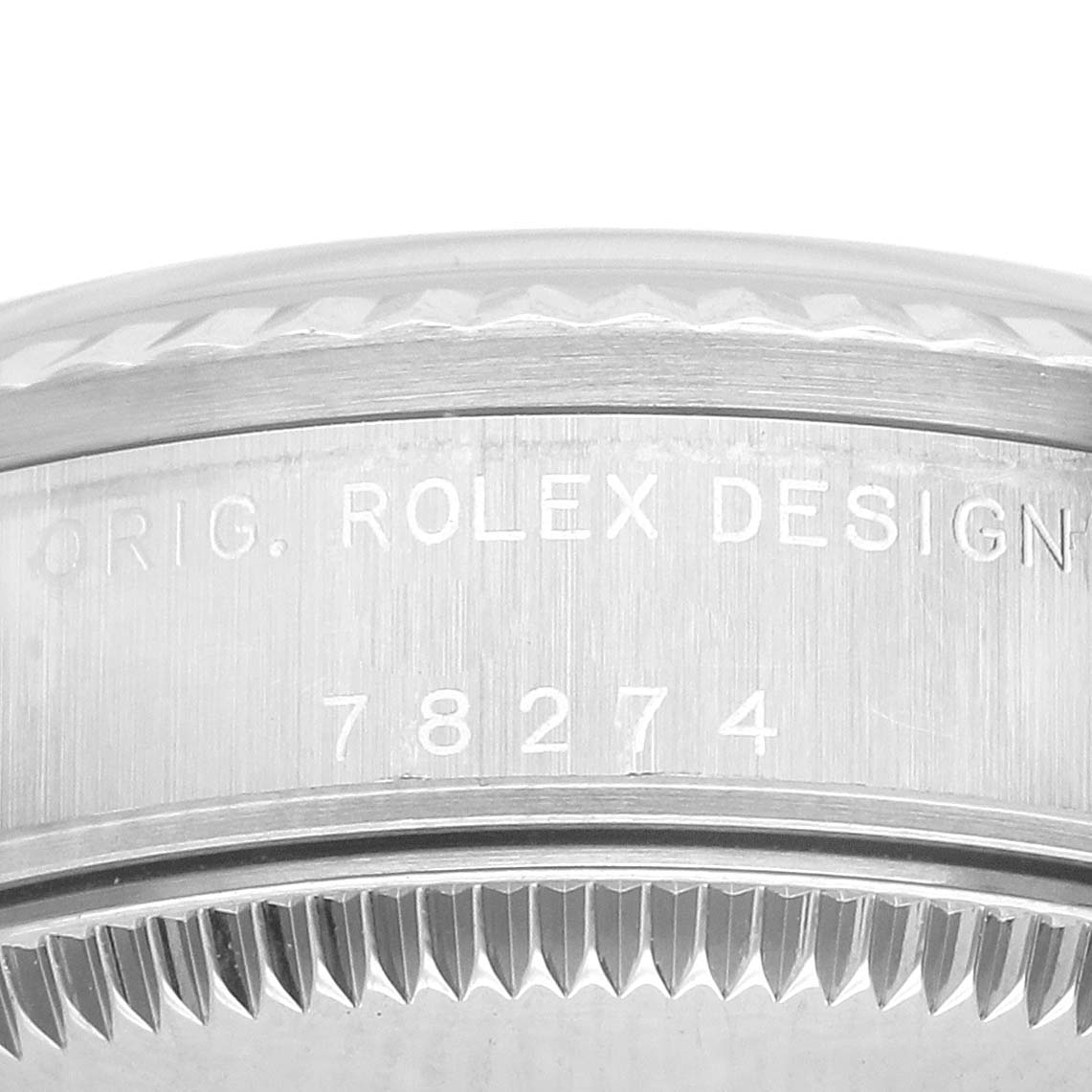 The image shows a close-up of the bezel and casing edge of a Rolex Datejust 78274 Women's Stainless Steel Silver Dial, highlighting the engraved model number and design details.
