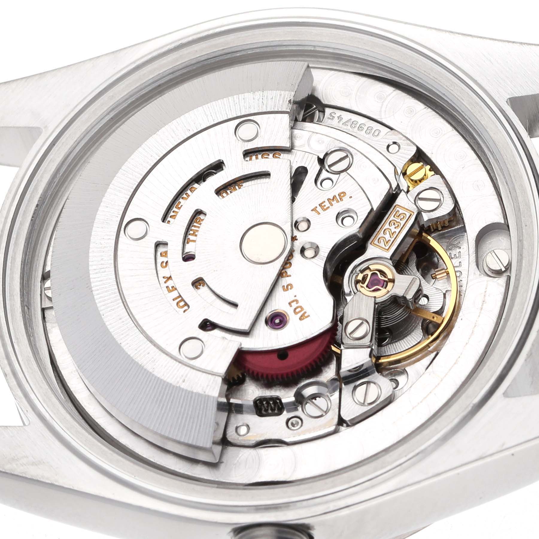 The image shows a close-up of the movement inside a Rolex Datejust 78274 Women's Stainless Steel Silver Dial, displaying the intricate mechanical components.