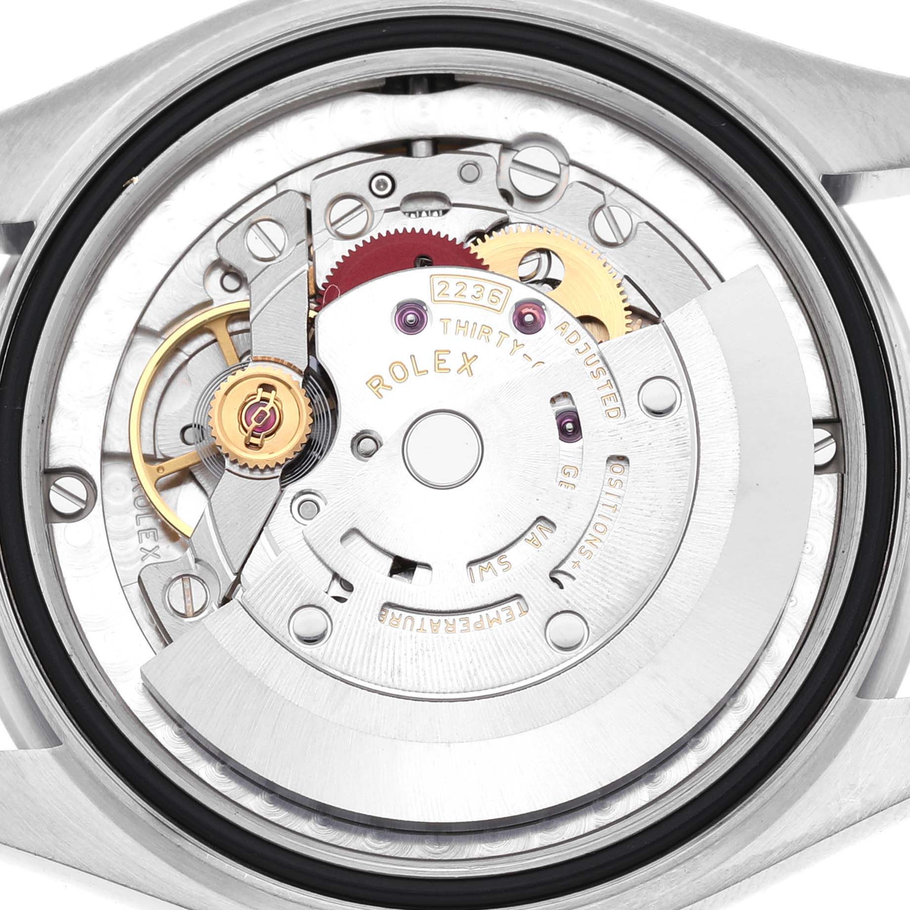 The image shows the movement from the back, highlighting the inner mechanics of the Rolex Mid-Size 278240 Women's Stainless Steel Pink Dial watch.
