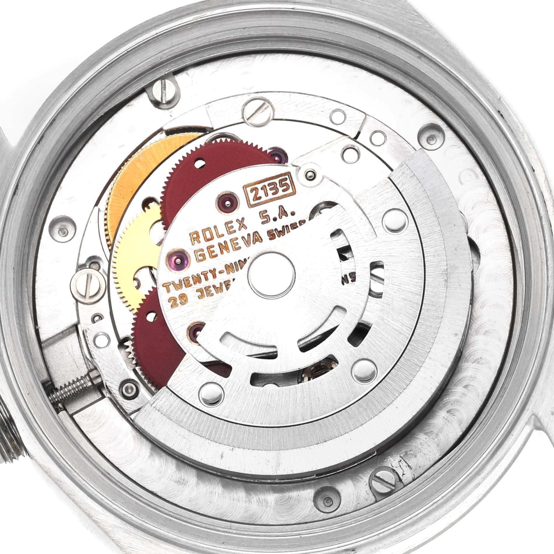 The image shows the internal mechanism and movement of a Mid-Size Rolex watch from a top-down angle.