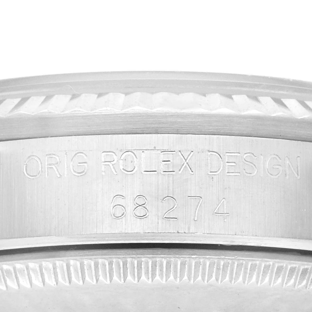 This image shows the engraved side of the case of a Mid-Size Rolex watch model 68274, with "ORIG ROLEX DESIGN" inscribed.