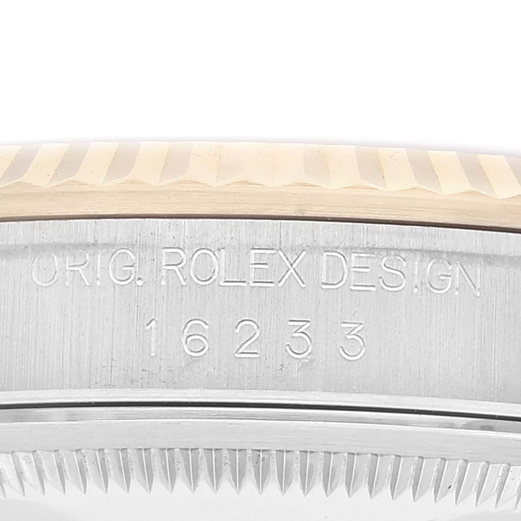 This image shows the side engraving on the case of a Rolex Datejust 16233 Men's Steel and Gold (two tone) White Dial 16233 Men's Steel and Gold (two tone) White Dial model, with model number 16233.
