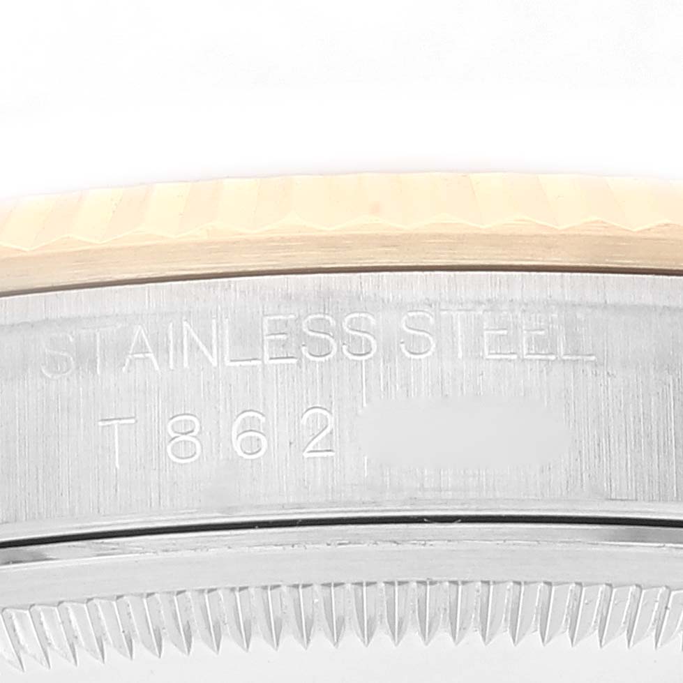 The image shows a close-up of the case back engraving of a Rolex Datejust 16233 Men's Steel and Gold (two tone) White Dial 16233 Men's Steel and Gold (two tone) White Dial, displaying the "Stainless Steel" text and serial number.