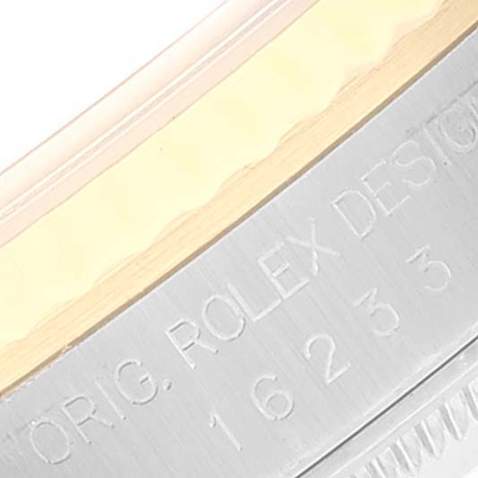This image shows a close-up of the bezel and engraved inner rim of a Rolex Datejust 16233 Men
s Steel and Gold (two tone) Grey Dial 16233 Men
s Steel and Gold (two tone) Grey Dial model.