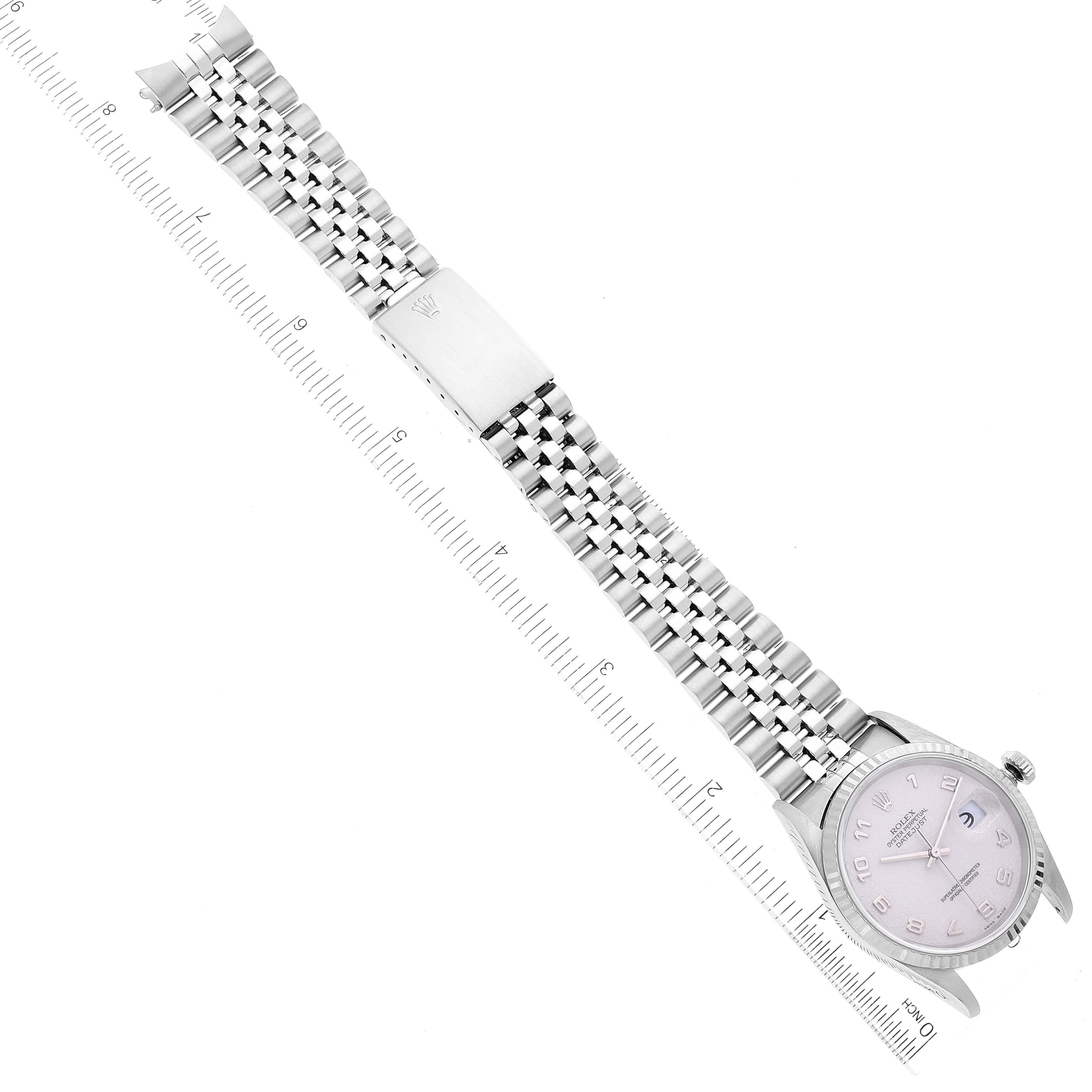 The image shows a top-down view of a Rolex Datejust 16234 Men's Stainless Steel Silver Dial 16234 Men's Stainless Steel Silver Dial watch with a ruler aligned next to it for measurement.