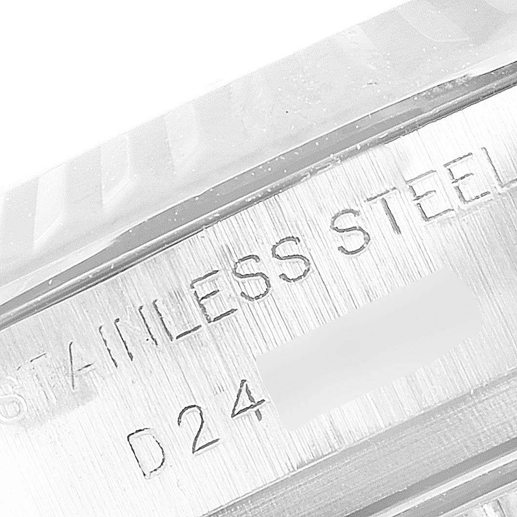 This close-up image shows the case side engraving of a stainless steel Rolex Datejust 179174 Women
s Stainless Steel White Dial 179174 Women
s Stainless Steel White Dial watch.