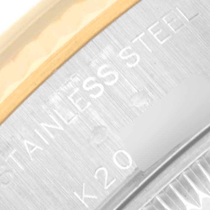 The close-up image shows a partial view of the case back of a Rolex Datejust 79173 Women's Steel and Gold (two tone) Blue Dial 79173 Women's Steel and Gold (two tone) Blue Dial, highlighting its stainless-steel material.