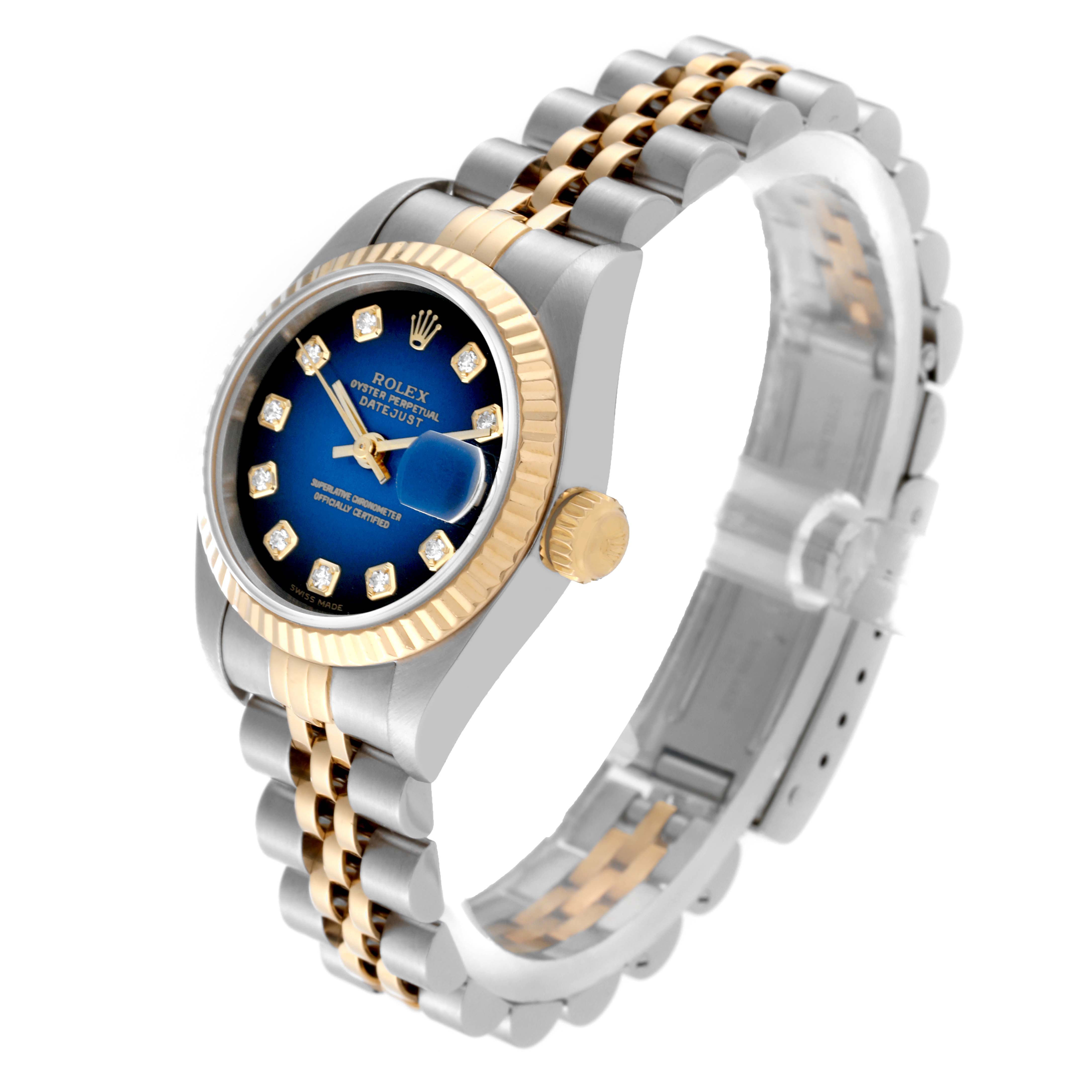 This image shows a Rolex Datejust 79173 Women's Steel and Gold (two tone) Blue Dial 79173 Women's Steel and Gold (two tone) Blue Dial watch at a three-quarter angle featuring its dial, crown, case, and bracelet.