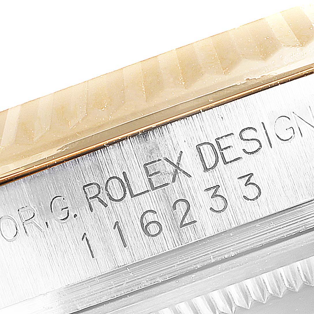 This image shows a close-up of the model and serial number engraving on the band of a Rolex Datejust 116233 Men's Steel and Gold (two tone) Blue Dial 116233 Men's Steel and Gold (two tone) Blue Dial watch.