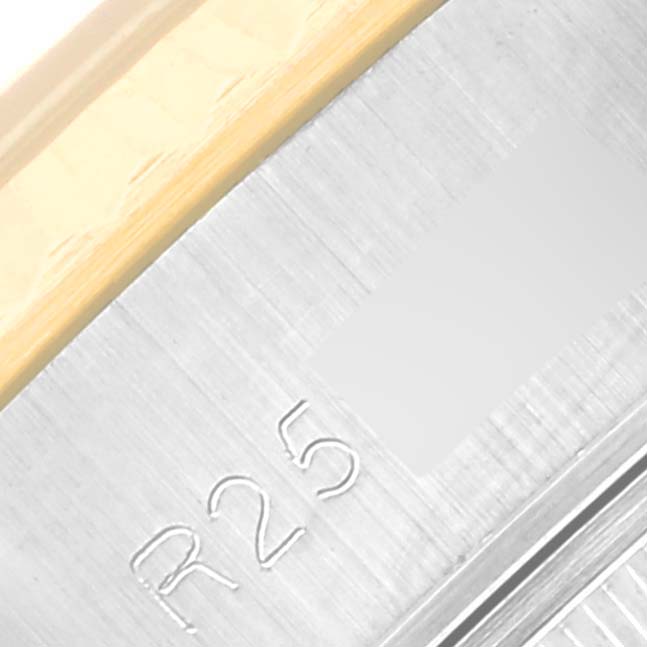 This is a close-up of the Rolex Datejust 69173 Women's Steel and Gold (two tone) Champagne Dial 69173 Women's Steel and Gold (two tone) Champagne Dial watch, showcasing the side of the casing and part of the bezel.