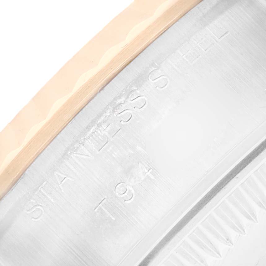 The image shows a close-up of the Rolex Datejust 69173 Women's Steel and Gold (two tone) Champagne Dial watch, highlighting the stainless steel and gold fluted bezel.