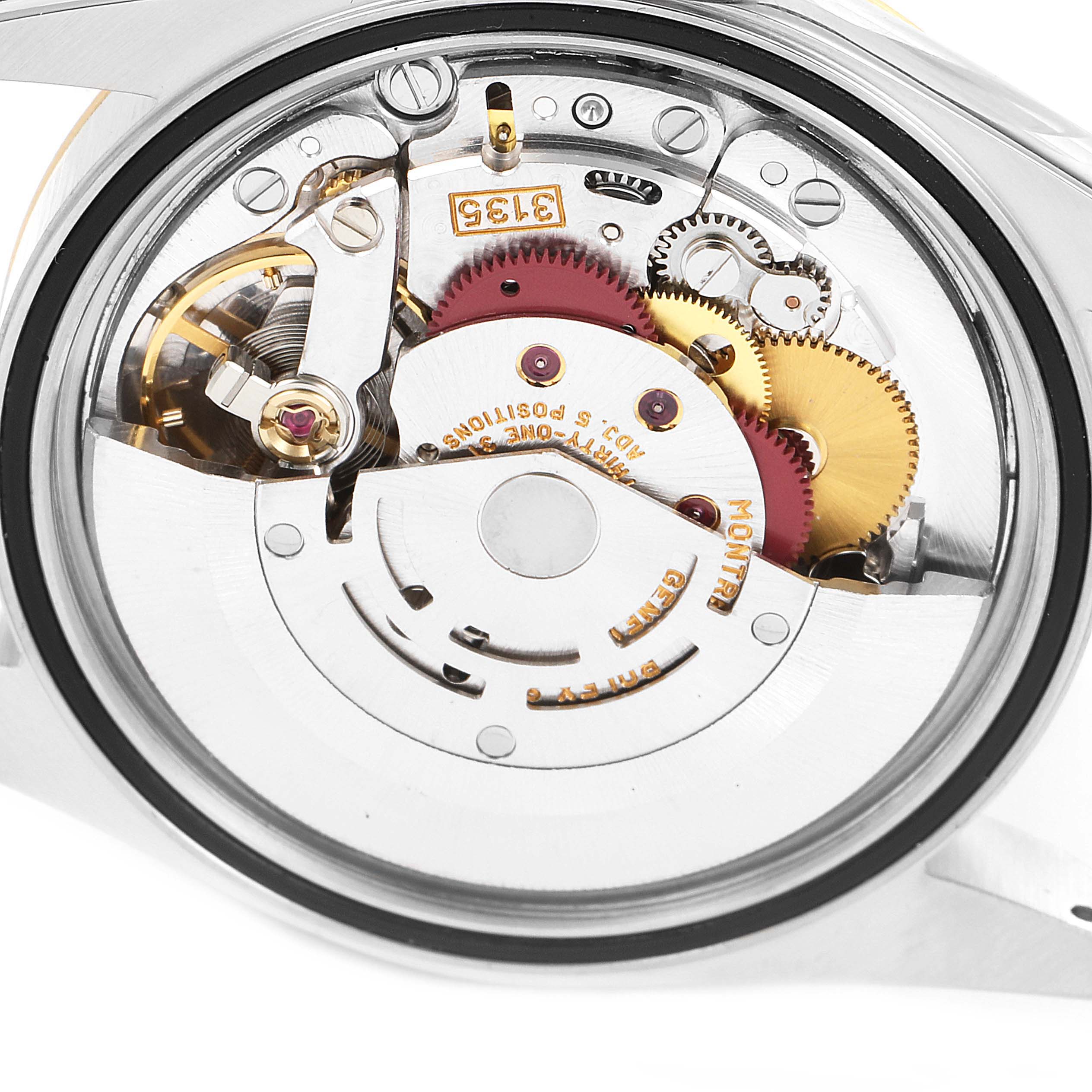 The image shows the movement and internal mechanics of a Rolex Datejust 16233 Men's Steel and Gold (two tone) Beige Dial 16233 Men's Steel and Gold (two tone) Beige Dial watch from a rear angle.
