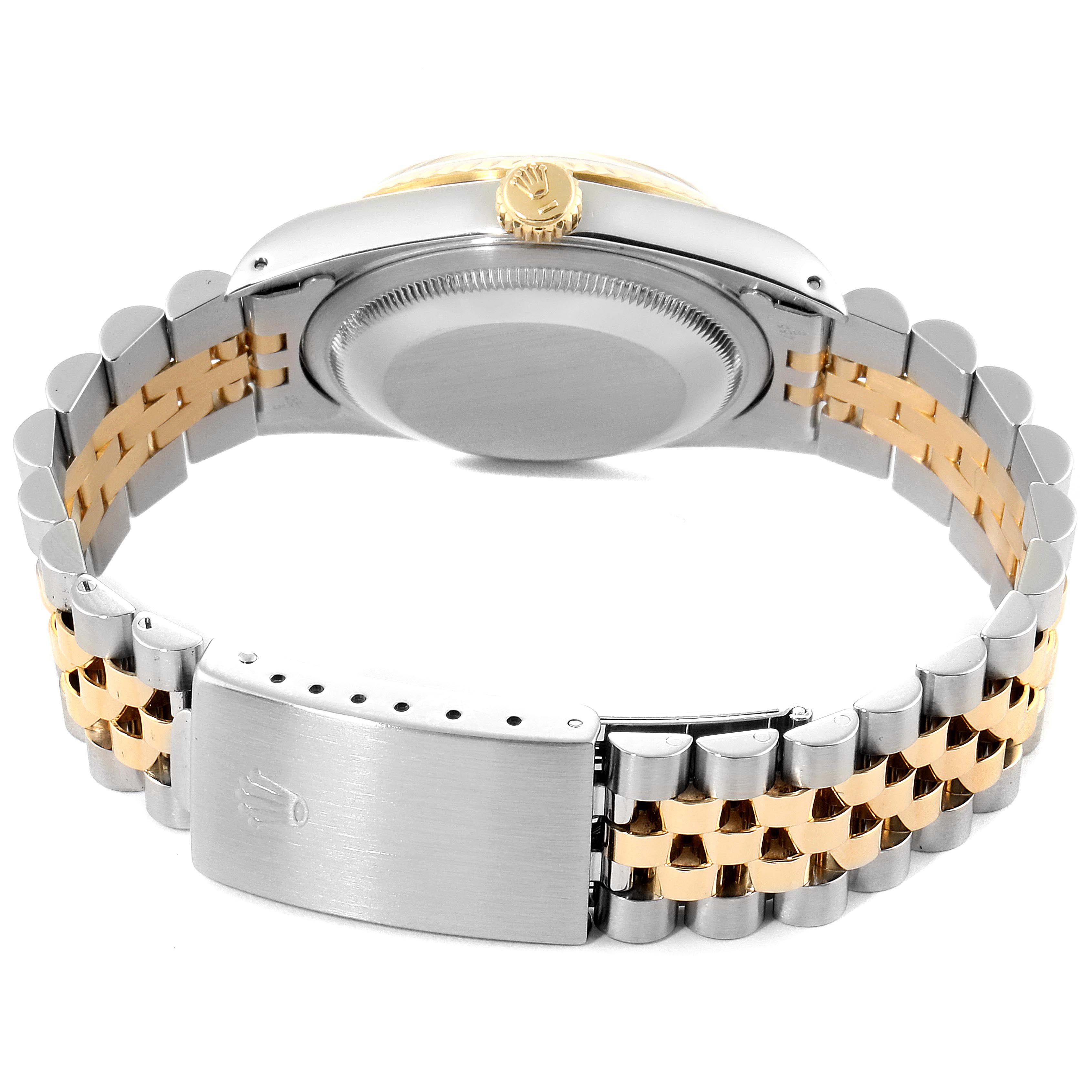 This is a rear view of a Rolex Datejust 16233 Men
s Steel and Gold (two tone) Silver Dial 16233 Men
s Steel and Gold (two tone) Silver Dial watch showing the case back, bracelet, and clasp.